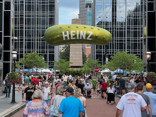 Crowd gather to see floating Pickle in PPG Palace