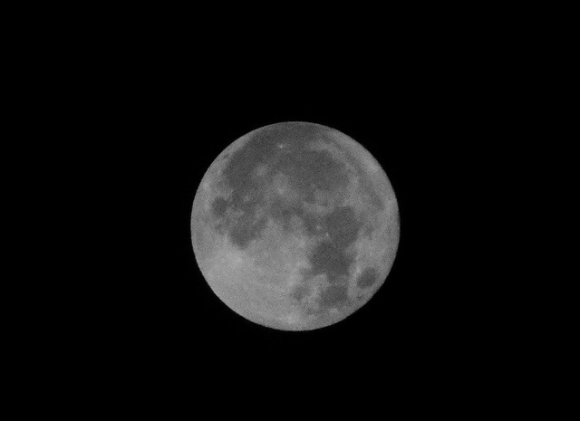 Super full moon with hazy high clouds