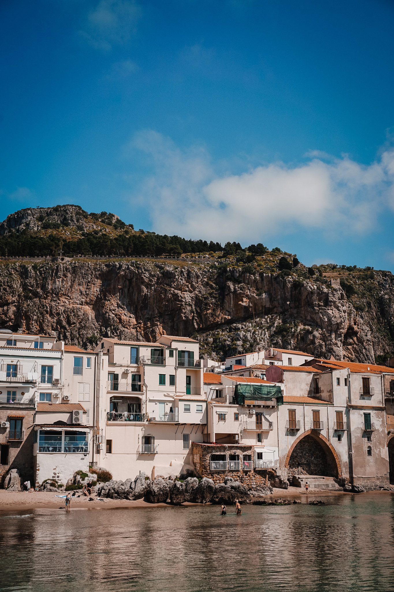 La Rocca as the backdrop of Cefalu | Explore the Picturesque Town of Cefalu | Cefalu Sicily Travel Guide | What to See, Do and Eat in Cefalu | Discover the Best Things to do in Cefalu, Sicily, Italy | Sicily Travel Tips | Visit Sicily