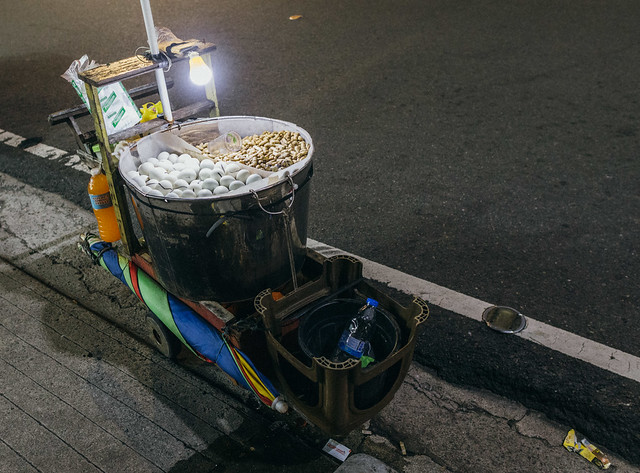 balut (duck embryo in an egg) and boiled peanuts street food cart