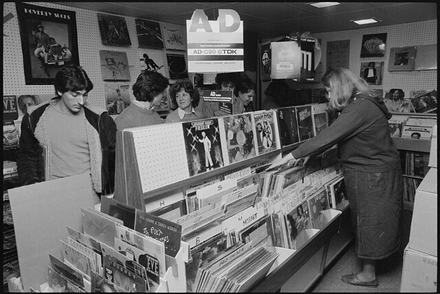 [Georgetown University students looking through racks of records at a record store, Washington, D.C.] (LOC)