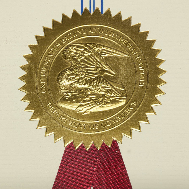 An embossed seal of the US Patent and Trademark Office