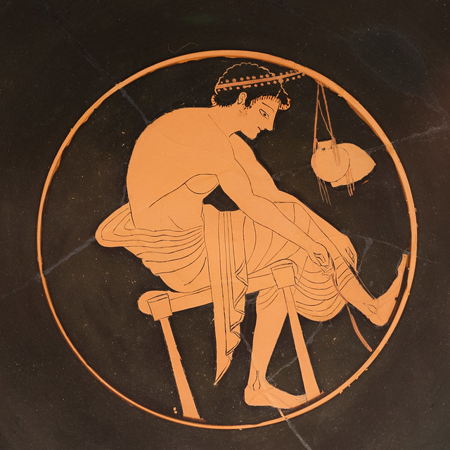 Athenian Red Figure kylix with tondo representing a youth lacing his sandal, 2