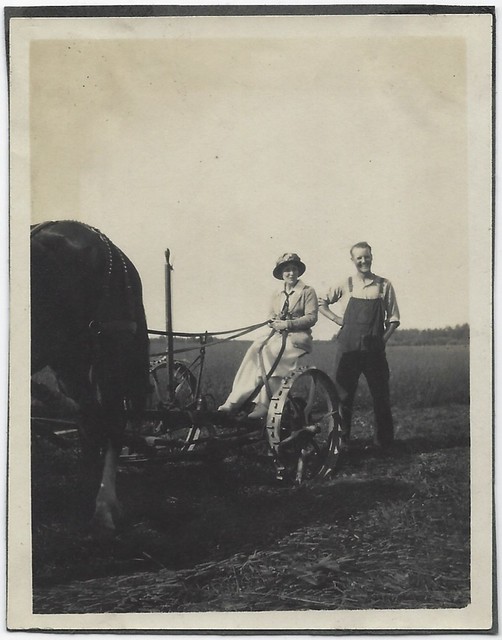Couple Posed With Sickle Mower. Photograph.