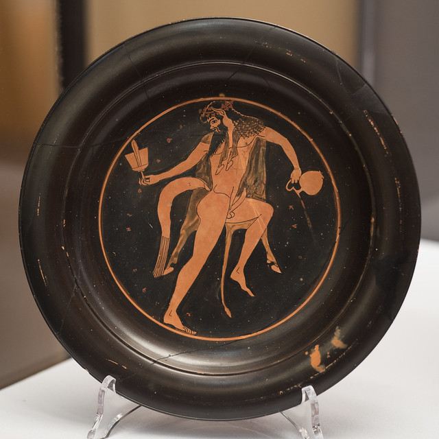 Athenian Red Figure plate with representation of an ithyphallic silen with kantharos and oinochoe, 1