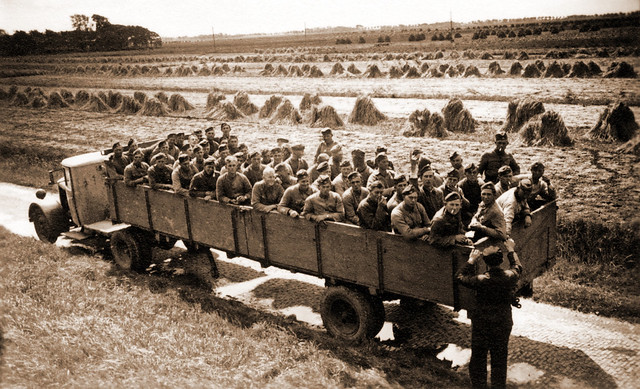 A Mercedes-Benz semi-trailer truck transporting Reichsarbeitsdienst in Germany circa WW2
