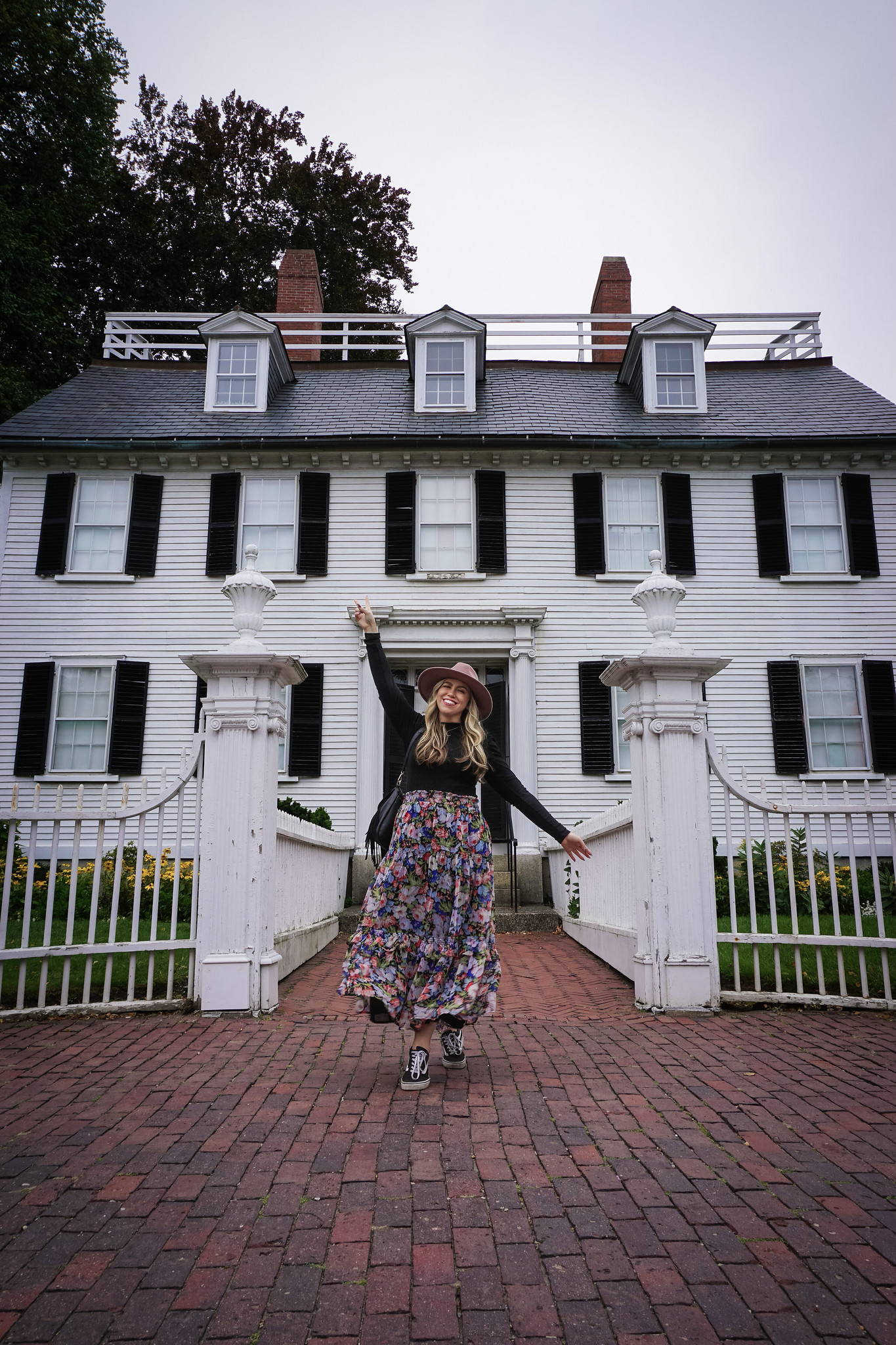 Girl posing in front of the Ropes Mansion