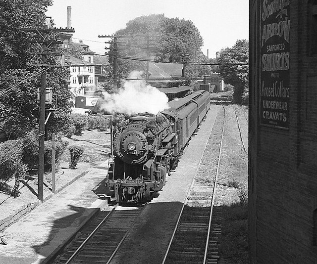 Boston & Albany D-1A class Suburban 4-6-6T steam locomotive 401 with a commuter passenger train departs the station at Brookline, Massachusetts, 9-2-1949