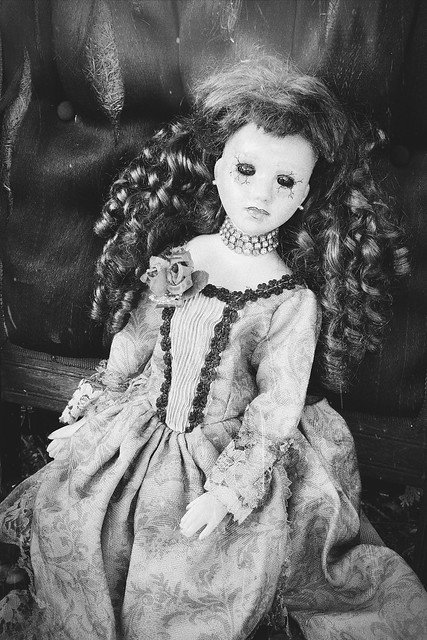 Creepy Doll on Antique Chai