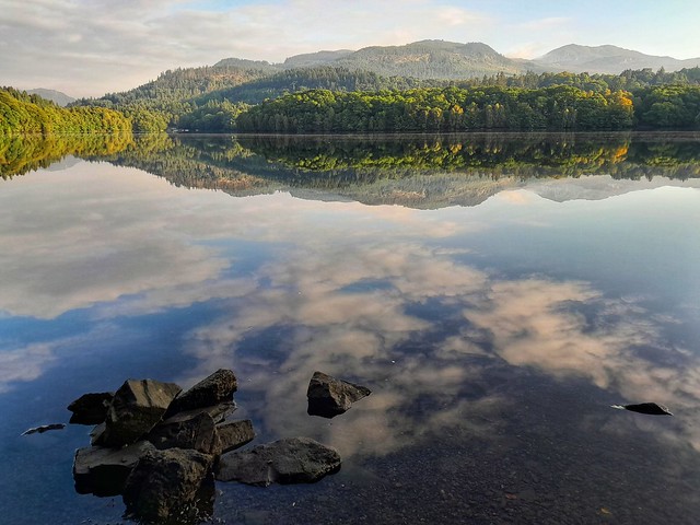 Reflections on Loch Faskally Pitlochry with the Mountain Ben Vrackie top right.