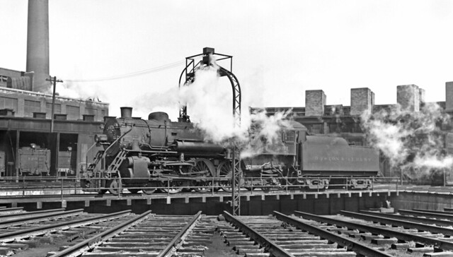 Boston & Albany class Kj 1911 ALCO built 4-6-2 Pacific steam locomotive 551, is seen on the roundhouse turntable at West Springfield, Massachusetts 4-24-1936