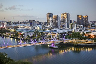 View of Kurilpa Bridge and South Brisbane at sunrise.
