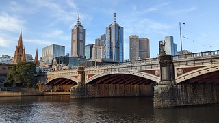 Princes Bridge over the Yarra River and Melbourne city skyline during summer sunset