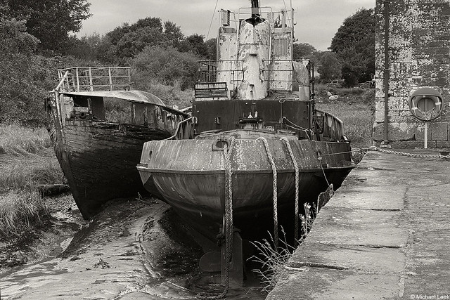 Abandoned Scotland; former fishing trawler and a tug discarded in Annan Port, Dumfries & Galloway, Scotland.