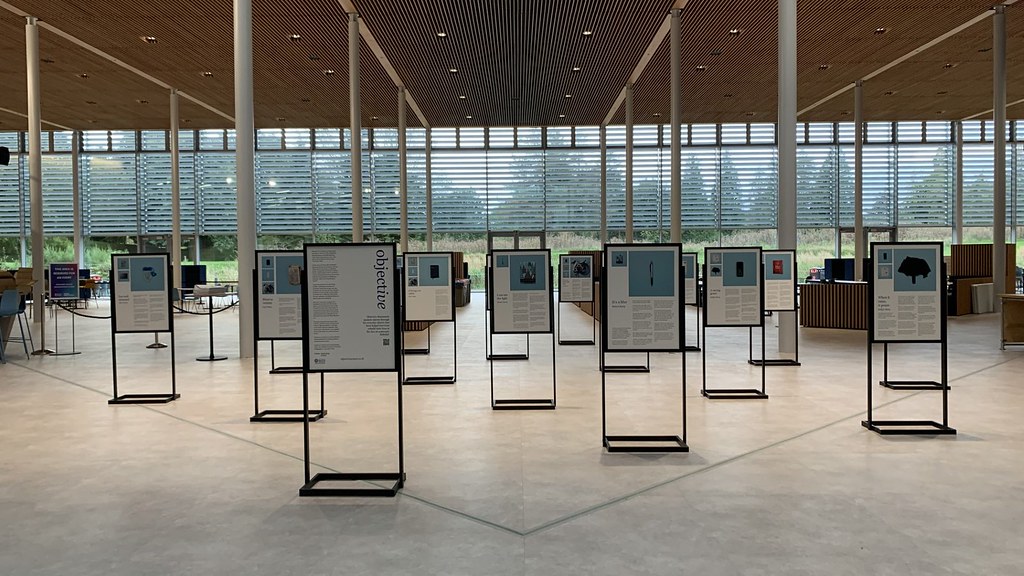 A photo showing the Objective project photos on display in the School of Management building