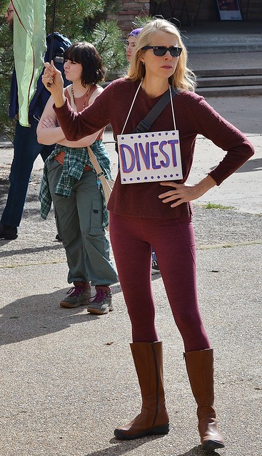Climate change protester calls for divestment from the fossil fuel industry.