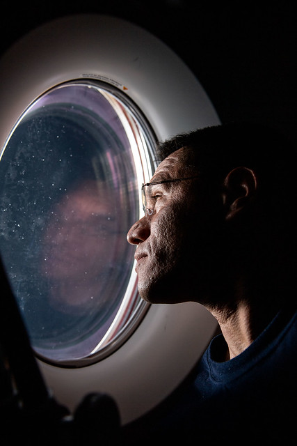 Astronaut Frank Rubio peers out of a SpaceX Dragon spacecraft window