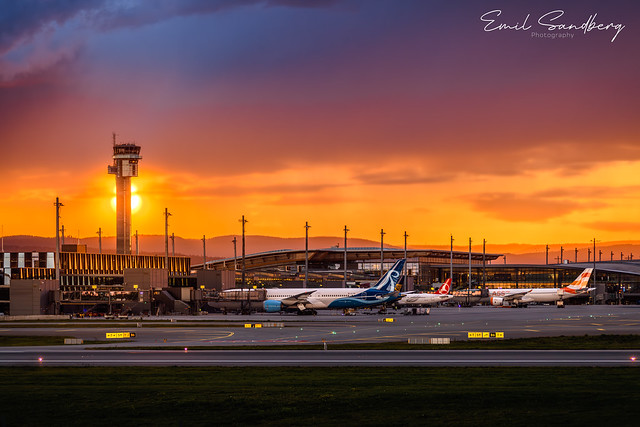 Oslo Airport with the sun going down just behind the tower