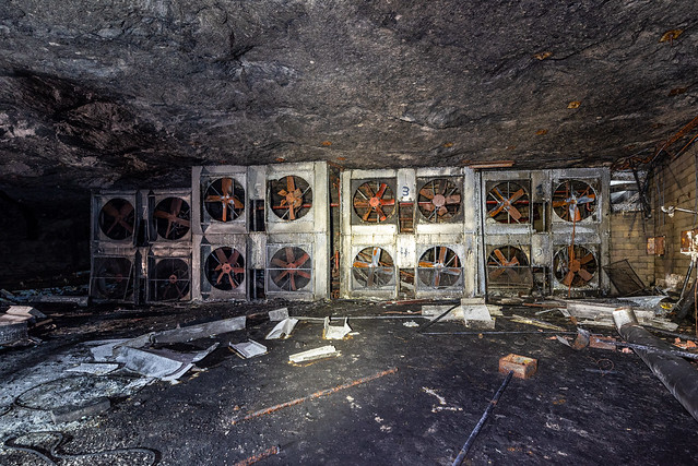 human height fans in an abandoned underground storage facility