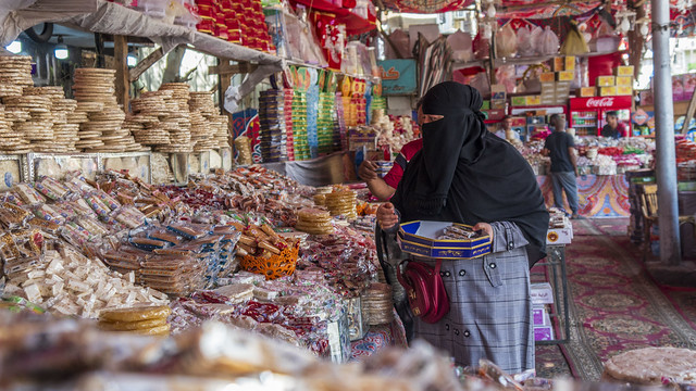 A customer buying El-Moulid sweets at Cairo's El-Sayeda Zeinab