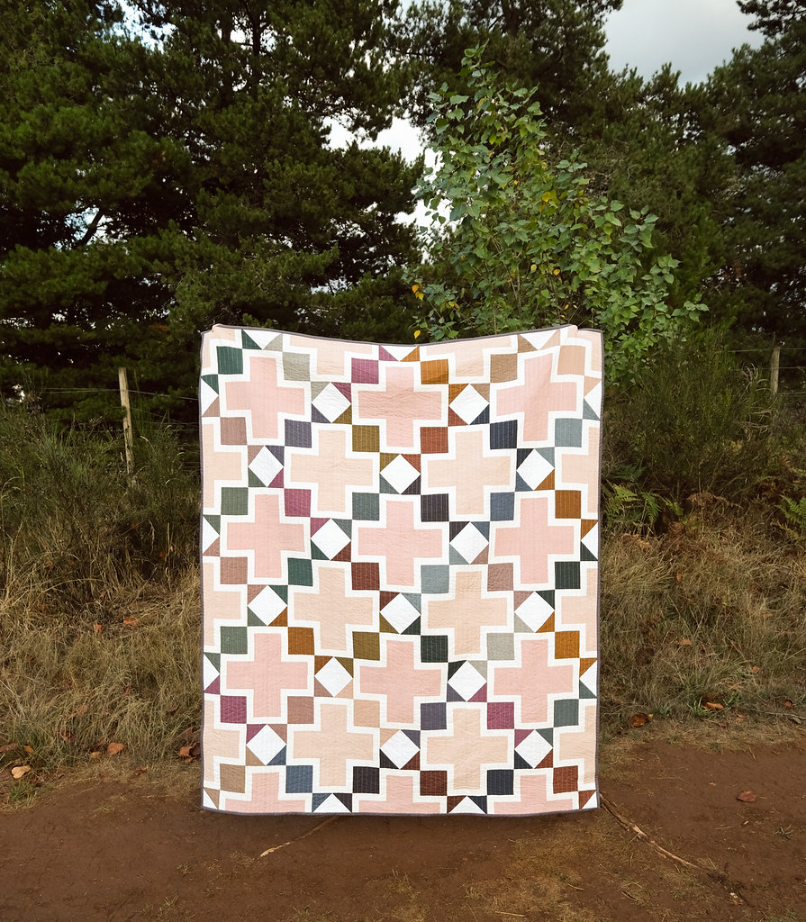 The Tabitha Quilt Pattern by Kitchen Table Quilting using Nocturne from Fableism. This is a fat eighth, fat quarter, or layer cake friendly patterns that is great for experienced beginners.