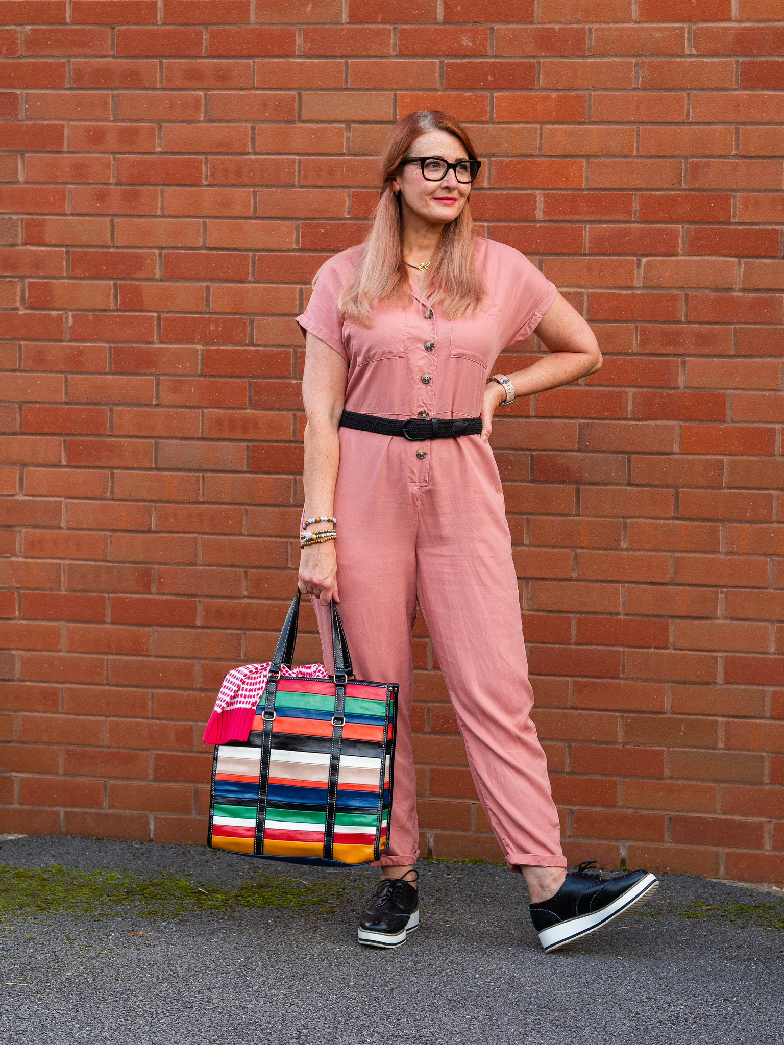 Secondhand September: What I've Worn and Rediscovered (Catherine Summers AKA Not Dressed As Lamb wearing a rose pink jumpsuit, red and white patterned sweater, black belt and flatforms and a multi-coloured striped shopper)