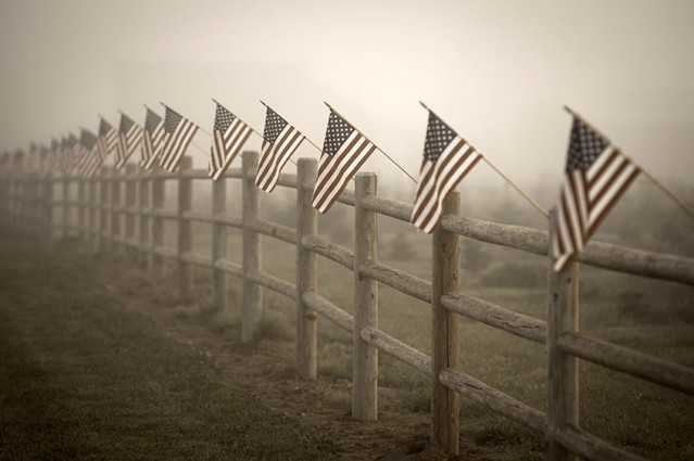 Farm with fence and American flags