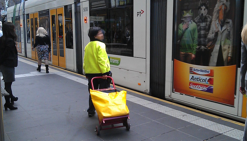 Postal worker making deliveries by tram, 2013