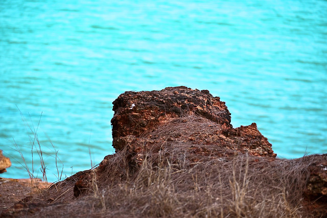 Red Rocky Outcrop Overhanging the Northern Australia Coastline