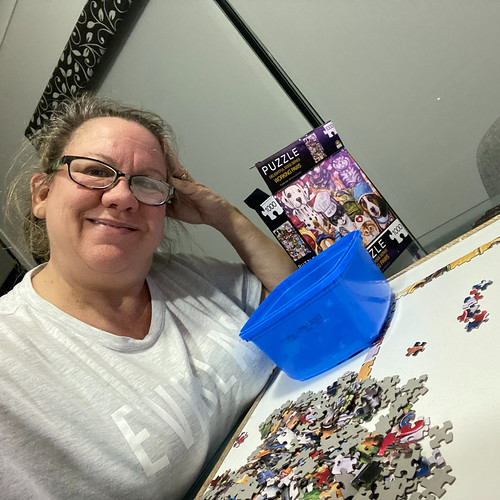 selfie of middle aged woman doing jigsaw puzzle