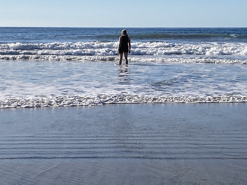 Me standing in the surf on a San Diego beach, looking out to sea