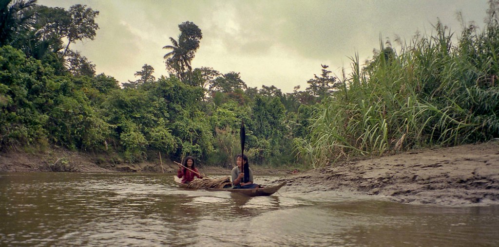 Women in dugout canoe; Sekalio back to coast, Siberut, Mentawai Islands, Sumatra, Indonesia