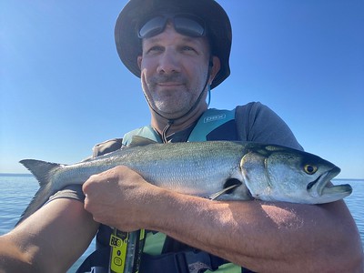 Photo of man holding a fish