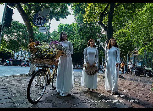 Women in ao dai on Phan Dinh Phung Street, Hanoi, Vietnam