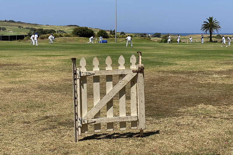 Picket fence gate at cricket field