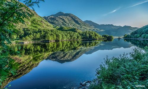 Loch Eilt on the "Road to the Isles." Stunning beauty of a summer sunset that can be shared on the "Hogwart's Express." by Scotland by NJC., Poem.
On a late May evening,
the north-western setting sun
falls below the