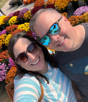 Carrie and I in Front of Flowers