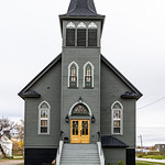 Elim Lutheran Church, Sault Ste. Marie, Michigan, United States Built in 1906 at no. 700 Eureka Street. Now an Airbnb. 

&amp;quot;Sault Ste. Marie (/ˌsuː seɪnt məˈriː/ SOO-seint-ma-REE) is the only city in, and county seat of, Chippewa County in the U.S. state of Michigan. With a population of 14,144 at the 2010 census, it is the second-most populated city in the Upper Peninsula after Marquette. It is the central city of the Sault Ste. Marie, MI Micropolitan Statistical Area, which encompasses all of Chippewa County and had a population of 38,520 at the 2010 census.

Sault Ste. Marie was settled as early as 1668, which makes it Michigan&#039;s oldest city and among the oldest cities in the United States. Located at the northeastern edge of the Upper Peninsula, it is separated by the St. Marys River from the much-larger city of Sault Ste. Marie, Ontario. The two are connected by the Sault Ste. Marie International Bridge, which represents the northern terminus of Interstate 75. This portion of the river also contains the Soo Locks, as well as a swinging railroad bridge. The city is also home to Lake Superior State University.

For centuries Ojibwe (Chippewa) Native Americans had lived in the area, which they referred to as Baawitigong (&amp;quot;at the cascading rapids&amp;quot;), after the rapids of St. Marys River. French colonists renamed the region Saulteaux (&amp;quot;rapids&amp;quot; in French).

In 1668, French missionaries Claude Dablon and Jacques Marquette founded a Jesuit mission at this site. Sault Ste. Marie developed as the fourth-oldest European city in the United States west of the Appalachian Mountains, and the oldest permanent settlement in contemporary Michigan state. On June 4, 1671, Simon-François Daumont de Saint-Lusson, a colonial agent, was dispatched from Quebec to the distant tribes, proposing a congress of Indian nations at the Falls of St. Mary between Lake Huron and Lake Superior. Trader Nicolas Perrot helped attract the principal chiefs, and representatives of 14 Indigenous nations were invited for the elaborate ceremony. The French officials proclaimed France&#039;s appropriation of the immense territory surrounding Lake Superior in the name of King Louis XIV.

In the 18th century, the settlement became an important center of the fur trade, when it was a post for the British-owned North West Company, based in Montreal. The fur trader John Johnston, a Scots-Irish immigrant from Belfast, was considered the first European settler in 1790. He married a high-ranking Ojibwe woman named Ozhaguscodaywayquay, the daughter of a prominent chief, Waubojeeg. She also became known as Susan Johnston. Their marriage was one of many alliances in the northern areas between high-ranking European traders and Ojibwe. The family was prominent among Native Americans, First Nations, and Europeans from both Canada and the United States. They had eight children who learned fluent Ojibwe, English and French. The Johnstons entertained a variety of trappers, explorers, traders, and government officials, especially during the years before the War of 1812 between Britain and the United States.

For more than 140 years, the settlement was a single community under French colonial, and later, British colonial rule. After the War of 1812, a US–UK Joint Boundary Commission finally fixed the border in 1817 between the Michigan Territory of the US and the British Province of Upper Canada to follow the river in this area. Whereas traders had formerly moved freely through the whole area, the United States forbade Canadian traders from operating in the United States, which reduced their trade and disrupted the area&#039;s economy. The American and Canadian communities of Sault Ste. Marie were each incorporated as independent municipalities toward the end of the 19th century.

As a result of the fur trade, the settlement attracted Ojibwe and Ottawa, Métis, and ethnic Europeans of various nationalities. It was a two-tiered society, with fur traders (who had capital) and their families and upper-class Ojibwe in the upper echelon. In the aftermath of the War of 1812, however, the community&#039;s society changed markedly.

The U.S. built Fort Brady near the settlement, introducing new troops and settlers, mostly Anglo-American. The UK and the US settled on a new northern boundary in 1817, dividing the US and Canada along St. Mary&#039;s River. The US prohibited British fur traders from operating in the United States. After completion of the Erie Canal in New York State in 1825 (expanded in 1832), the number of settlers migrating to Ohio and Michigan increased dramatically from New York and New England, bringing with them the Yankee culture of the Northern Tier. Their numbers overwhelmed the cosmopolitan culture of the earlier settlers. They practiced more discrimination against Native Americans and Métis.

The falls proved a choke point for shipping between the Great Lakes. Early ships traveling to and from Lake Superior were portaged around the rapids[8] in a lengthy process (much like moving a house) that could take weeks. Later, only the cargoes were unloaded, hauled around the rapids, and then loaded onto other ships waiting below the rapids. The first American lock, the State Lock, was built in 1855; it was instrumental in improving shipping. The lock has been expanded and improved over the years.

In 1900, Northwestern Leather Company opened a tannery in Sault Ste. Marie. The tannery was founded to process leather for the upper parts of shoes, which was finer than that for soles. After the factory closed in 1958, the property was sold to Filborn Limestone, a subsidiary of Algoma Steel Corporation.

In March 1938 during the Great Depression, Sophia Nolte Pullar bequeathed $70,000 for construction of the Pullar Community Building, which opened in 1939. This building held an indoor ice rink composed of artificial ice, then a revolutionary concept. The ice rink is still owned by the city.&amp;quot; - info from Wikipedia. 

Now on &lt;a href=&quot;https://www.instagram.com/billyd.wilson/&quot; rel=&quot;noreferrer nofollow&quot;&gt;Instagram&lt;/a&gt;.

Become a patron to my photography on &lt;a href=&quot;https://www.patreon.com/billywilson&quot; rel=&quot;noreferrer nofollow&quot;&gt;Patreon&lt;/a&gt; or &lt;a href=&quot;https://www.paypal.com/cgi-bin/webscr?cmd=_s-xclick&amp;amp;hosted_button_id=E74U8G8TZKYDJ&quot; rel=&quot;noreferrer nofollow&quot;&gt;donate&lt;/a&gt;.