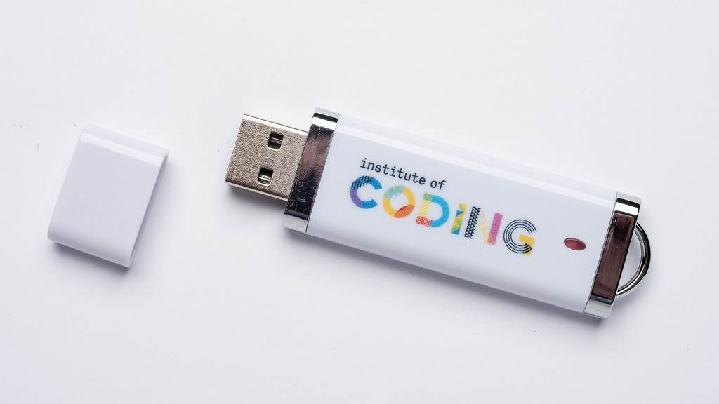 A Institute of Coding-branded USB thumb drive.