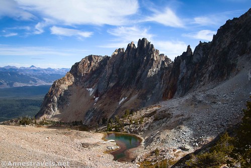 Views down on an unnamed pond and a Sawtooth ridgeline from the top of a Class 4 scramble en route up Mount Thompson, Sawtooth Wilderness, Idaho
