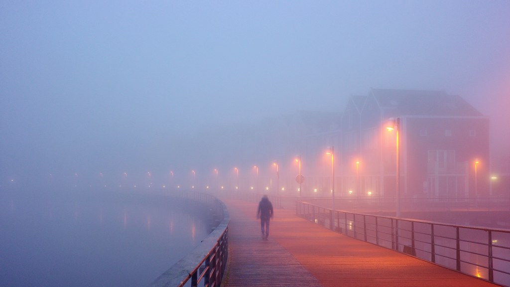 Walker on a bridge in the mist (Explored)