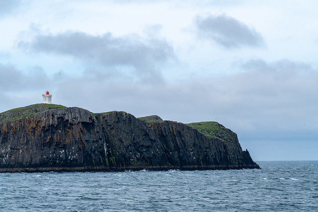 Lighthouse on Elliðaey (ELLIDAEY) Island, with basalt cliffs on Breidafjördur Bay