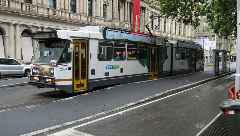 B-class tram passing platform stops under construction in Elizabeth Street (October 2013)