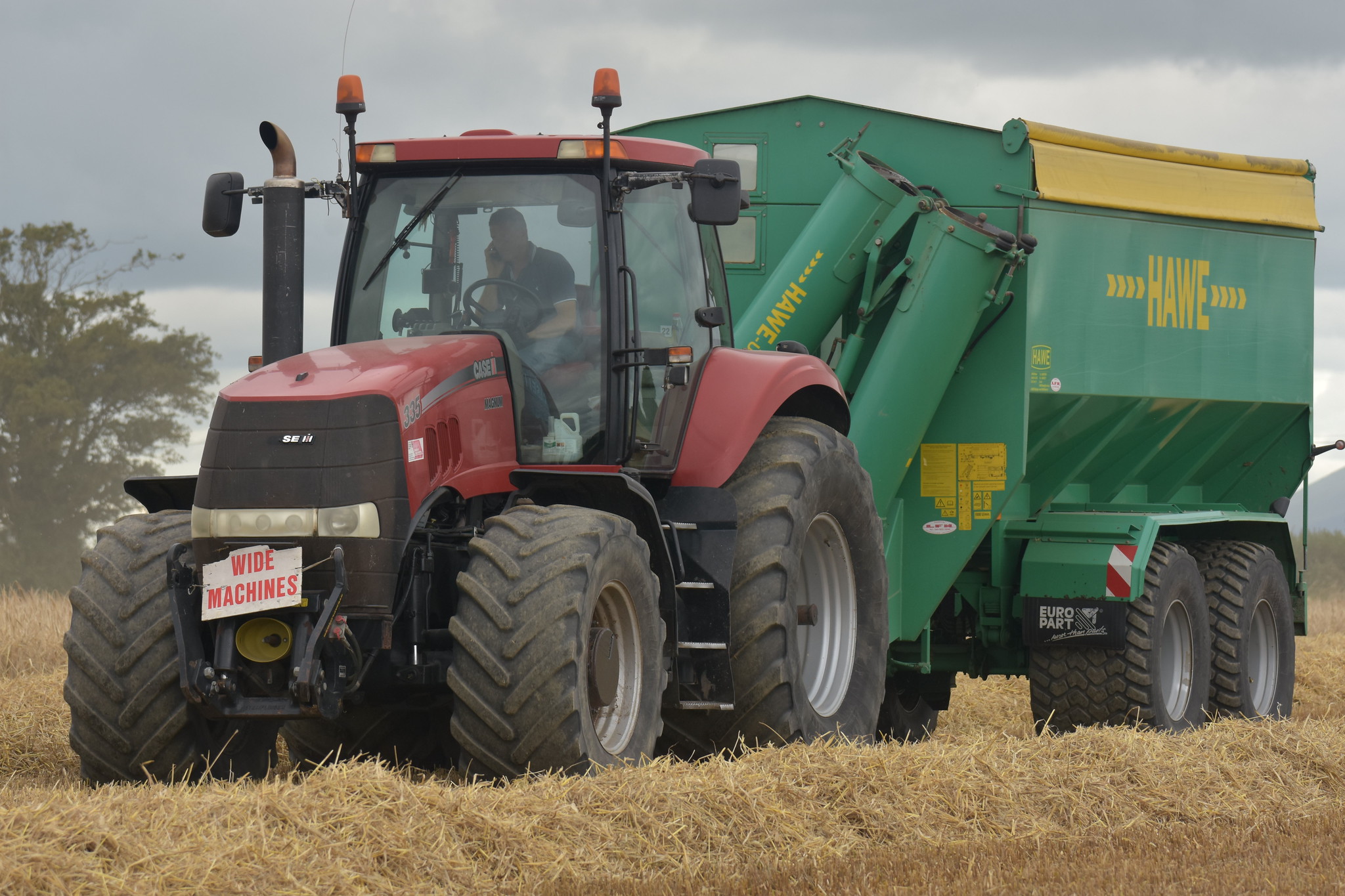 Case IH Magnum 335 Tractor with a Hawe Chaser Bin