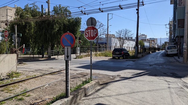 Level crossing at Αιγάλεω on abandoned railway on Μεθώνης in Piraeus in Athens, Greece