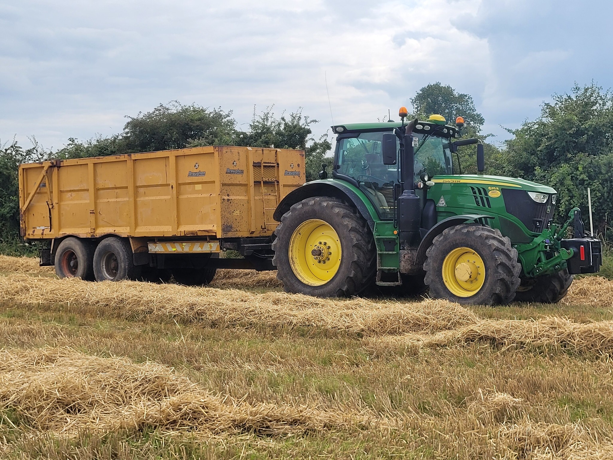 John Deere 6215R Tractor with a Broughan Engineering Trailer