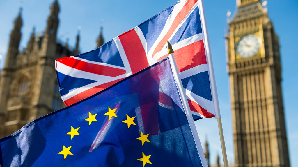 European Union and British Union Jack flag flying infront of Big Ben and the House of Parliament Photo credit Adobe Stock
