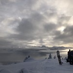 Recreation 20230215-FS-MM-Tongass-backcountryskiing-MtTroy-0006 Skiers transition their gear in the clouds, with Admiralty National Monument peaking through, atop Mt Troy. USDA photo by Megan McMillan