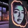 a black and white photo of a woman's face, by artist, street art, glowing neon skin, lee madgwick & liam wong, solo portrait :art:️, glowing peach face, asian face, vantablack wall, glowing screen, hyperrealism photo, face in-frame, full protrait