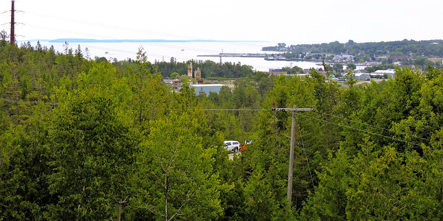 View of Mackinac Island, Round Island, Bois Blanc Islands in Lake Huron; St. Ignace on the shore; powerlines